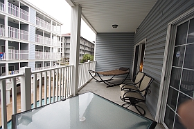 Sky Blue Vacation Condo, Myrtle Beach - Upper Balcony with hammock, table four chairs